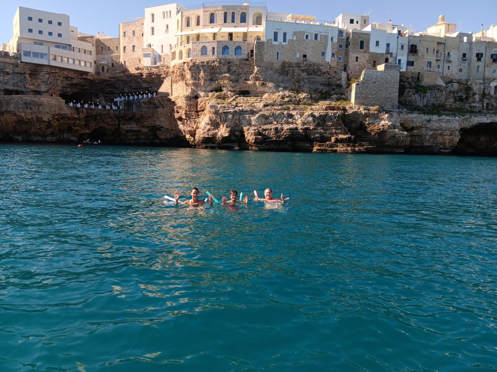Lorena swimming below Grotta Palazzese, Polignano a Mare September 