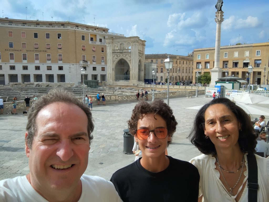The talianTourism team of us in Piazza Sant’Oronzo, Lecce, Puglia, with historic buildings and the Roman amphitheater nearby during our visit to southern Italy 
